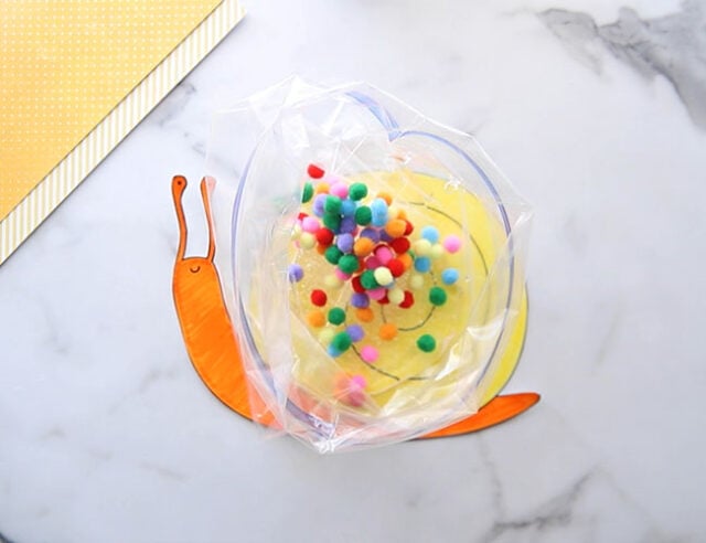 Add Pom Poms to Sensory Bag