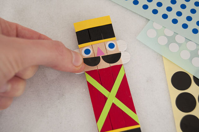 Adding nutcracker face stickers