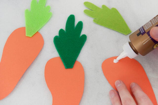 Attaching carrot tops to carrots