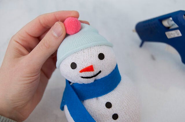 Hat and pom pom on snowman