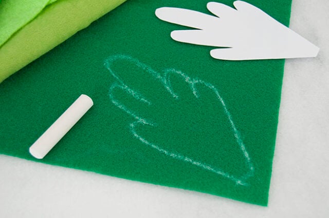 Tracing template onto green felt